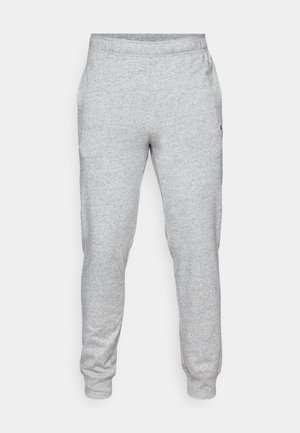 Gray sweatpants made of soft, textured material, featuring an elastic waistband and tapered legs, with a small logo on the side.