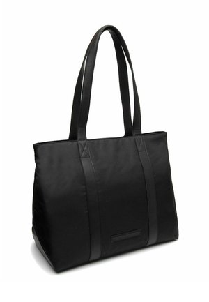 Sac fourre-tout noir avec un corps en tissu, des accents en cuir et des poignées robustes. Présente une forme rectangulaire et des détails de couture visibles.