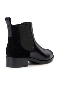Bottines Chelsea en cuir noir et suède avec panneaux latéraux en élastique, languette et talon empilé. Texture lisse avec une finition mate.
