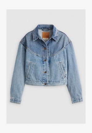 Heled sinine teksajakk, millel on krae, nööpkinnitus, rinna tasku ja kergelt lühiülikond. Märgatav pleekimine ja kulumine.