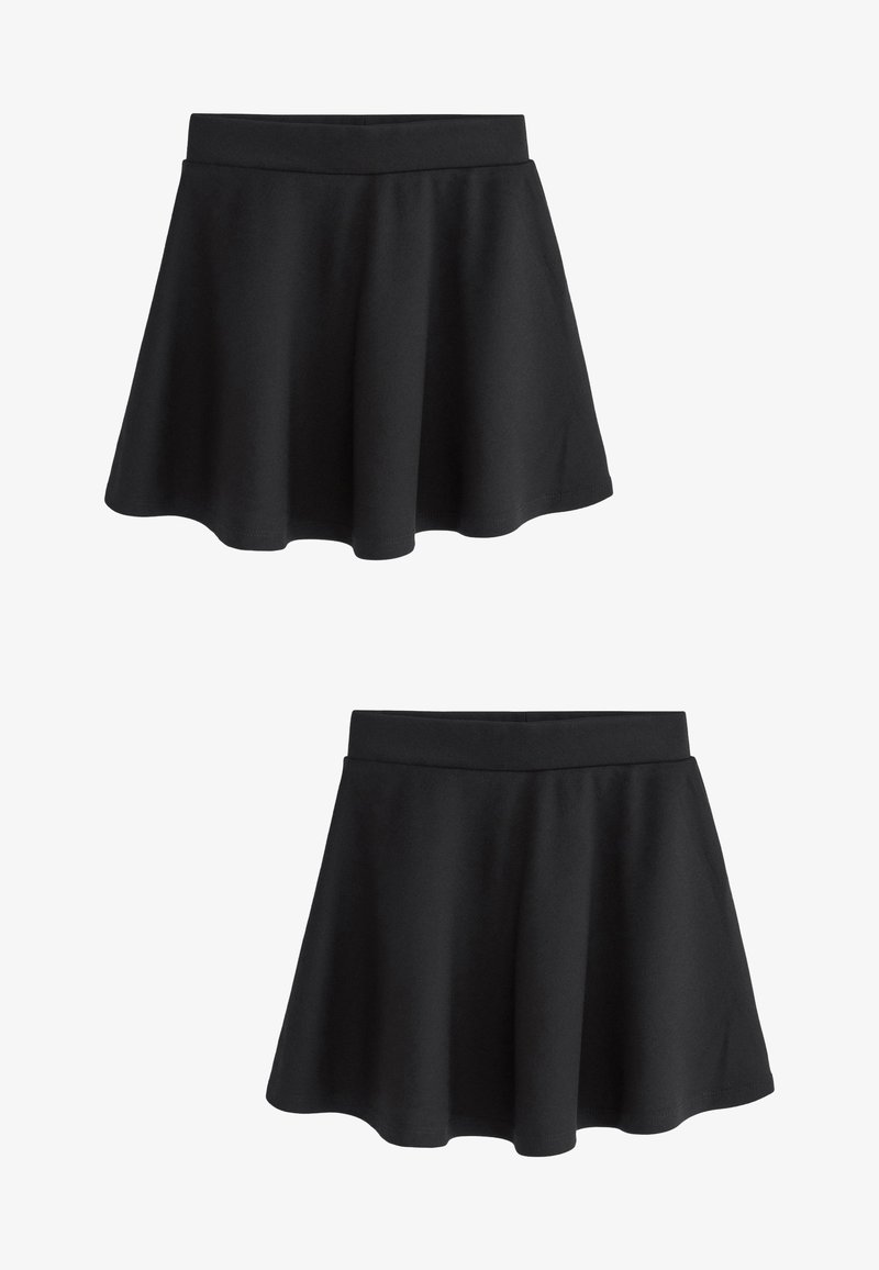 Must teras seeliku, mis on valmistatud pehmest kangast. Omab laia vööd ja sileda tekstuuri, mille ääreline osa ulatub õrnalt väljapoole.