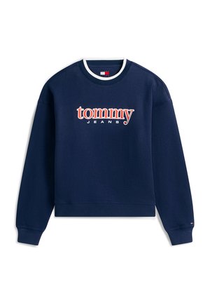 Mörkblå ribbad sweatshirt med rund halsringning, långa ärmar och en stor "tommy JEANS"-logotyp i rött och vitt över bröstet.