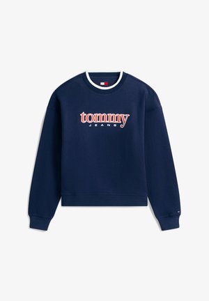 Tengerészkék bordázott pulóver kerek nyakkivágással, hosszú ujjakkal és a mellkason piros-fehér "tommy JEANS" logóval, oversized méretben.