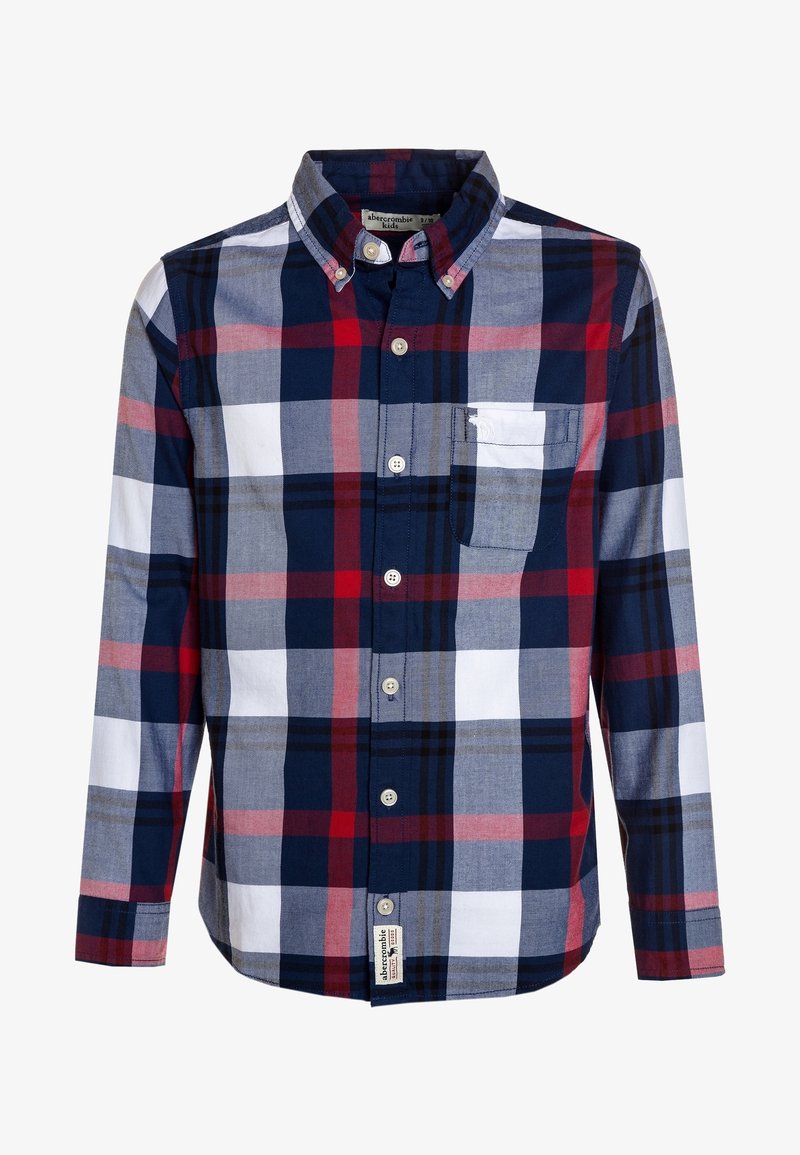 Koszula z guzikami, wykonana z bawełny w kratę w kolorach granatowym, czerwonym, szarym i białym. Posiada naszywaną kieszeń oraz kołnierzyk, długie rękawy.