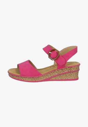 Pink suede wedge sandals with a textured beige cork sole. Features an adjustable strap with a hexagonal buckle and open-toe design.