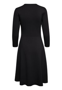 Musta mekko, jossa on istuva bodice ja levenevä hame. Pitkät hihat ja pyöreä kaula-aukko, valmistettu sileästä ja venyvästä kankaasta. Ei kuvioita tai korostuksia.