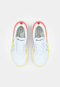 White athletic shoes with a mesh upper, featuring orange and yellow accents and a textured gray insole. Laces are flat and light blue.