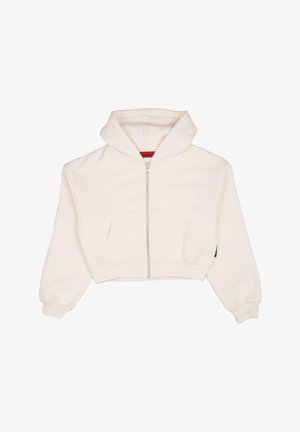 Lühendatud, üles tõmmatav kapuutsiga sviiter kreemivillasest kangast, millel on känguru taskud ja soonikkoes mansetid, ning mille küljel on väike must brändi silt.