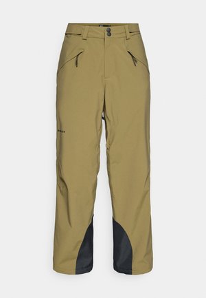 Oliivrohelised suusapüksid, mis on slim-fit lõikega, sisaldavad kahte esikot , musti aktsente puusade juures ja vastupidavat, tekstuurset kangast.