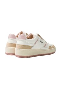 White sneakers with pink accents, featuring a textured sole, lace-up design, and logo on the side. Smooth leather and soft fabric materials.