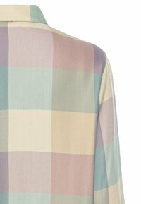 Long-sleeve shirt featuring a pastel plaid design in shades of green, pink, and cream, with a herringbone texture and classic collar.