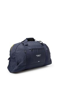 Borsa da viaggio blu navy con texture liscia, capacità di 70 litri, doppi manici superiori, tasca frontale con zip, dettaglio giallo e logo del marchio.