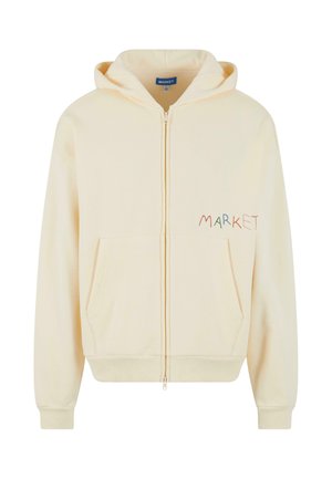 Világoskrém színű, cipzáros kapucnis pulóver puha anyagból, elülső zsebbel és színes "MARKET" hímzéssel a bal oldalon.