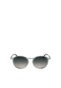 Round sunglasses with a translucent gray frame, dark gradient lenses, and silver accents on the arms. Minimalist design with sleek lines.