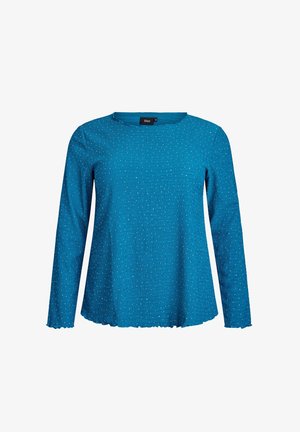 Blauw langemouw ribbeltop met kleine zilveren stippen, ronde halslijn en een iets golvende zoom en mouwmanchetten.
