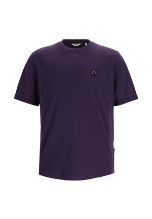 Violetti puuvillapaita, jossa on pyöreä kaula-aukko, lyhyet hihat ja musta neliön muotoinen pitkässä vasemmassa rinnassa oleva logo valkoisella.