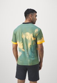 Nike Performance CULTURE OF FOOTBALL JERSEY - Sportska majica - bicoastal/black/sundial/bright crimson