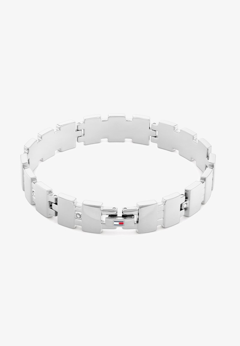 Silver stainless steel bracelet featuring a flat-link design with polished surfaces and connected segments, including a logo accent.