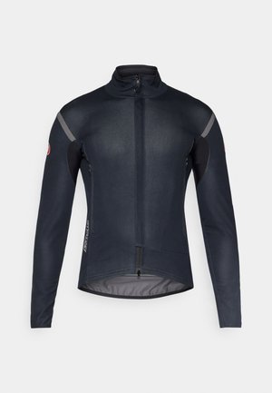 Veste de cyclisme pour homme, bleu marine avec un design épuré, col haut, accents réfléchissants et poches latérales zippées pour le rangement.