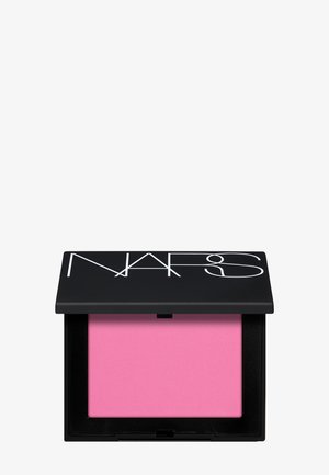 Boîtier de maquillage noir compact avec blush poudre rose et logo "NARS" blanc sur le couvercle, sur fond blanc.