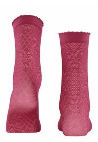 Calzini alla caviglia rosa con un design a motivo e bordi superiori ondulati, che mostrano un motivo a diamante e geometrico su tutta la superficie.