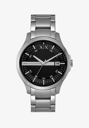 Silberne Metall-Armbanduhr von Armani Exchange mit schwarzem strukturiertem Zifferblatt, weißen Markierungen, Datumsanzeige bei 3 Uhr und drei Zeigern.
