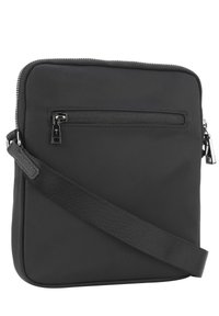 Borsa a tracolla nera in nylon con chiusura a zip, tasca frontale e tracolla regolabile. Texture liscia e design minimalista.