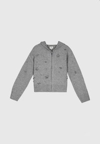 Sweat à capuche zippé gris avec des embellissements subtils, des poignets et un ourlet côtelés. Fabriqué en tissu doux avec une finition texturée.