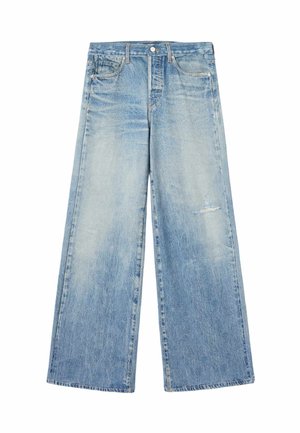 Jasnoniebieskie dżinsy z denimu o szerokich nogawkach, lekkie przetarcia na prawej udzie, przednie kieszenie i szlufki na pasek.