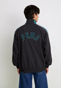 Puma T7  PLAY.LOUD. TRACK - Tréning dzseki - puma black