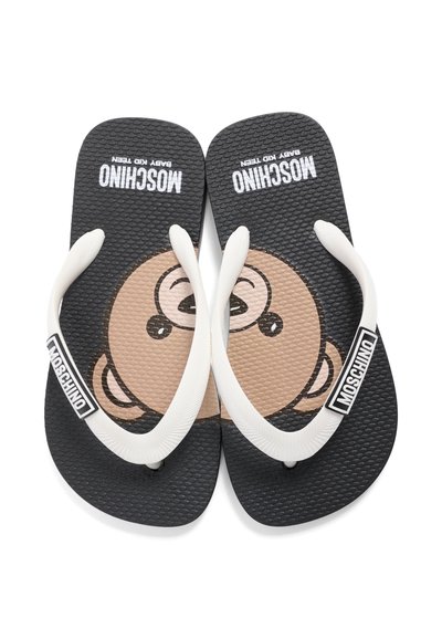 Μαύρα σαγιονάρες με λευκές λουρίδες, με παιδικό καρτούν πρόσωπο στις σόλες και τη σήμανση «Moschino Baby Kid Teen».