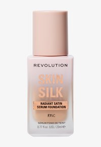 Revolution Skin Silk foundation i en frostet rosa flaske med matt hette. Etiketten har svart og metallisk rosegull tekst. 23 ml størrelse.