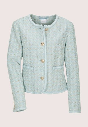 Hellblaues Tweedjackett mit strukturiertem Muster, rundem Ausschnitt, Fronttaschen und goldfarbenen Knöpfen. Abgesetzte Kanten verbessern das Gesamtbild.