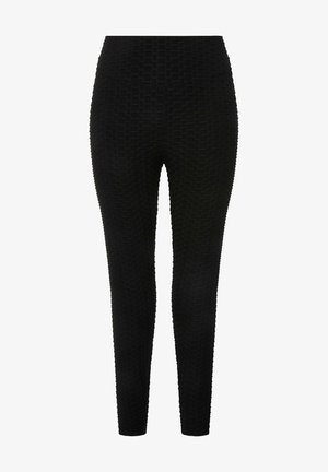 Schwarze Leggings mit einem strukturierten Muster in geometrischem Design, körpernahem Schnitt und glatter Oberfläche. Keine sichtbaren Beschläge oder Akzente.