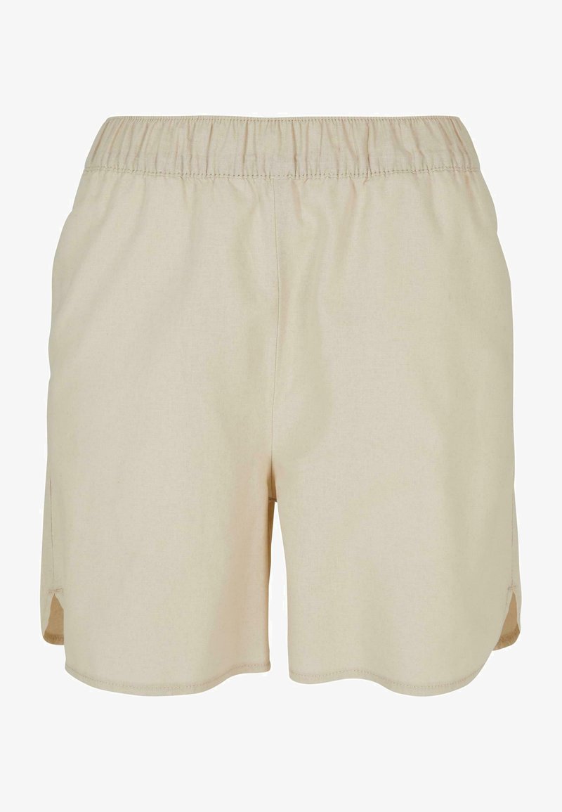 Beige shorts with an elastic waistband, made of soft fabric. Features side slits and a straight cut at the hem for ease of movement.