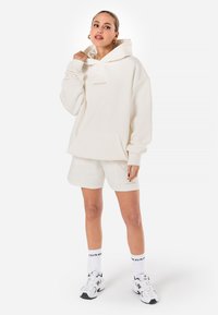 Pegador CLARITA - Camisola - washed warm white gum