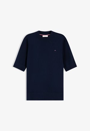 Tumesinine lühikeste varrukatega kudumpluus ümmarguse kaelusega ja väikese Tommy Hilfigeri logoga rinnal.