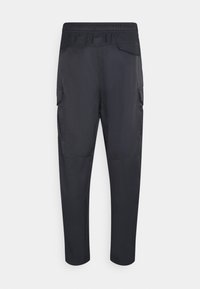 Black cargo pants featuring an elastic waistband, side pockets, and a smooth, lightweight fabric with a tapered leg design.