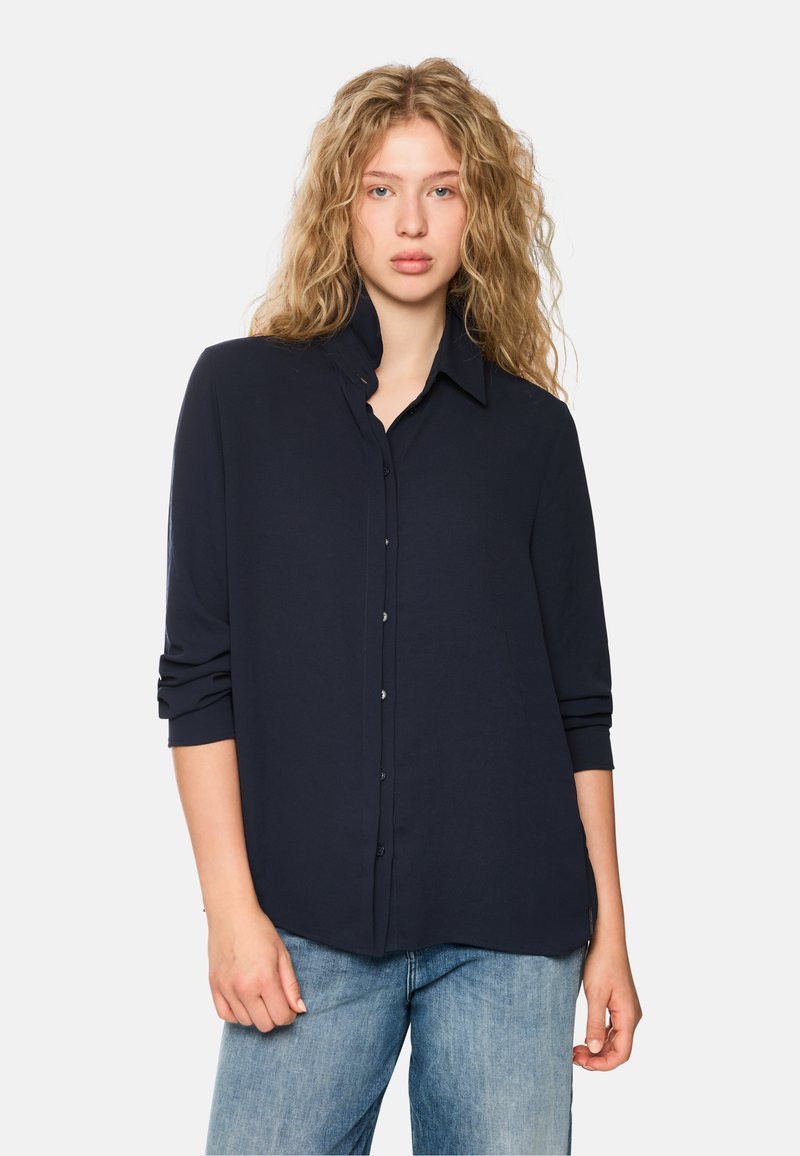Navy blue button-up shirt with a folded collar, long sleeves, and a smooth, lightweight fabric. The shirt has a relaxed fit.