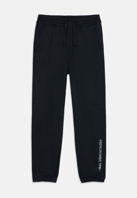 Black jogger pants with an elastic waistband, cuffed ankles, side pockets, and white text "ABERCROMBIE YPB" printed on the leg.