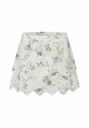 Valge lilleline seelik, millel on sakiline ääred, elastne vöökoht ja keeruline pitskate pastellsete lillemustertega. Kerge kangas.