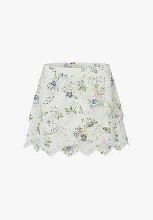 Falda floral blanca con dobladillo de ondas, cinturilla elástica y delicada cobertura de encaje con patrones de flores en tonos pastel. Tejido ligero.