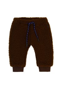 Braune Fleece-Hosen aus weichem, strukturiertem Stoff, mit einer marineblauen Kordel und braunen Rippstrickbündchen an den Knöcheln.