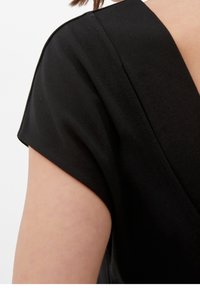 Black fabric dress with a V-neck design, short sleeves, and a smooth texture. Features a seam along the shoulder for added detail.