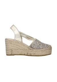 Elegante sandalo espadrilles con zeppa beige, soletta in juta intrecciata, parte superiore in tessuto scintillante e cinturini elasticizzati.