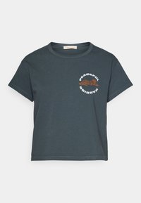 Dark gray cotton t-shirt with a round neckline, short sleeves, and a front graphic featuring a brown tiger and the text “Peaceful Warrior.”