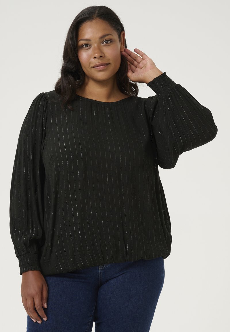 Blouse noire avec de longues manches bouffantes. Rayures scintillantes verticales sur un tissu texturé. Encolure ronde et poignets élastiques, coupe décontractée.