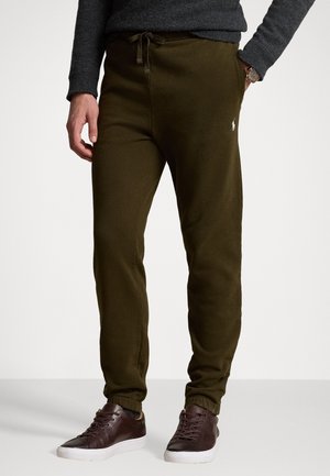 Olivovo zelené jogger nohavice s elastickým pásom a šnúrkou, s rebrovanými manžetami a malým vyšívaným logom.