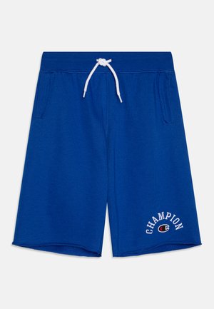 Blå sportshorts i mjukt tyg, med justerbar vit dragsko och sidofickor. Logotyp broderad på vänster fåll.