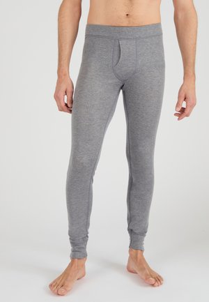 Leggings térmicos ajustados en gris, confeccionados con un material suave y elástico con una textura sutil, que cuentan con una amplia pretina elástica y sin costuras visibles.